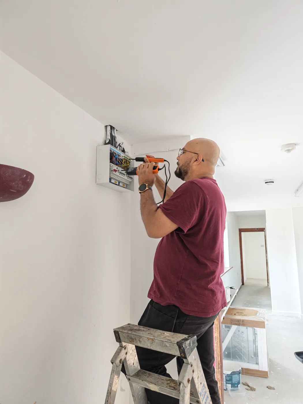 IMASSX Electric electrician testing a consumer unit